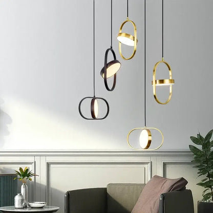 Modern gold and black oval pendant lights with sleek interlocking ring designs for kitchen decorbites gold pendant lighting