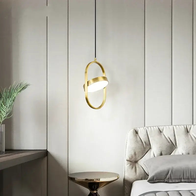 Modern gold and black oval pendant lights with gold-toned sleek design hanging from a black cord ideal for kitchen decorbites gold pendant