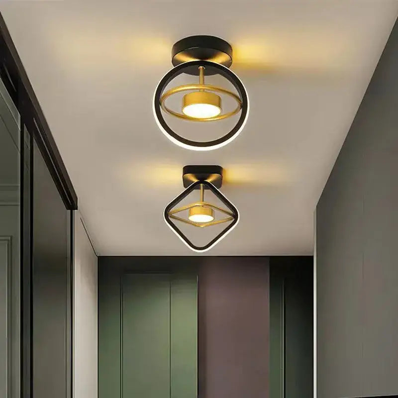 Modern gold and black ring led ceiling light with geometric frames emitting warm glow for living room decorbites led ceiling