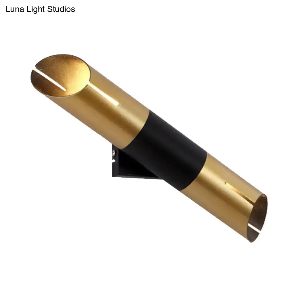Modern gold and black rotatable cylinder wall sconce with sleek minimalist design for bedroom lighting