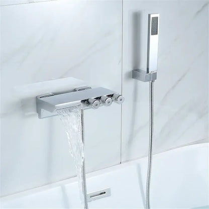 Modern chrome-finished shower set with waterfall spout, three control knobs, and handheld showerhead for gold black tub decorbites