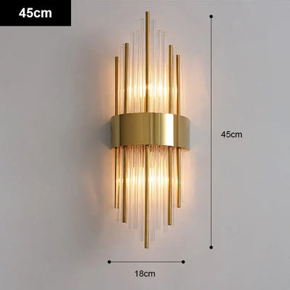 Modern gold and black stainless steel wall sconce with vertical glass rods and warm light for living room decorbites gold stainless