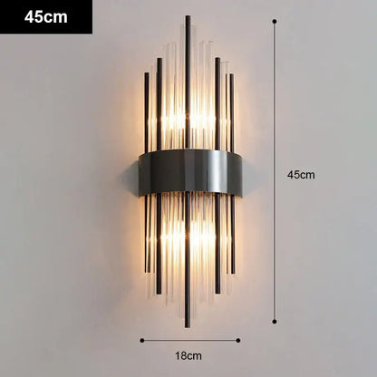 Modern gold and black stainless steel wall sconce with vertical glass rods emitting warm light for living room decorbites stainless steel
