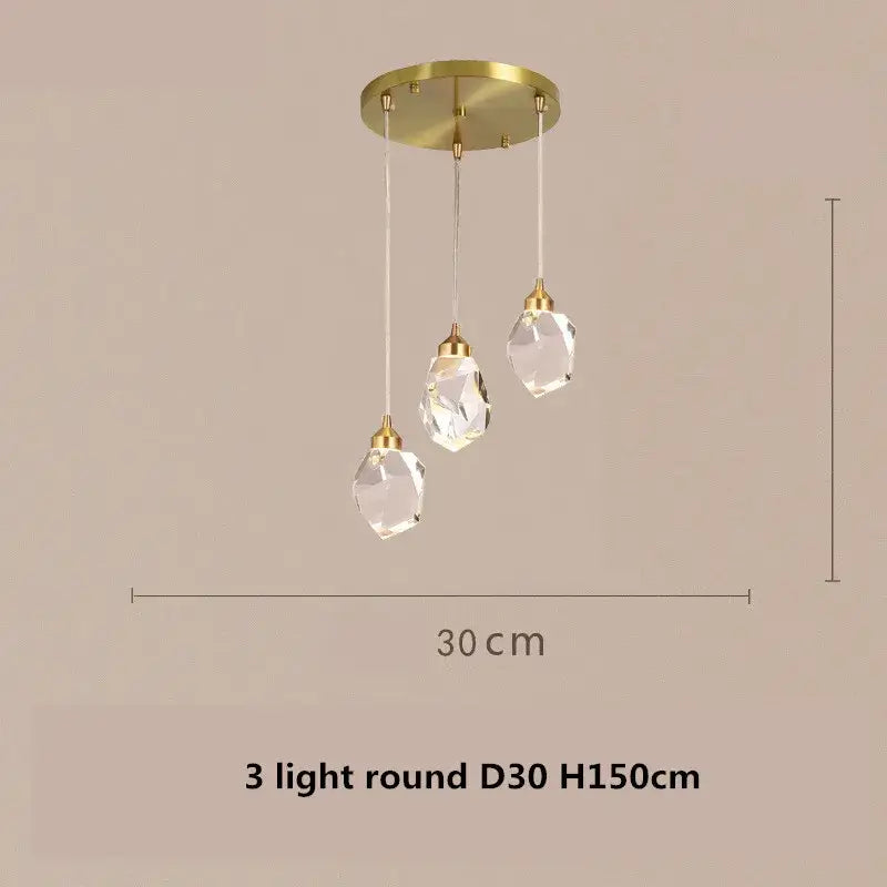 A modern gold dimmable crystal chandelier with three clear glass shades and circular ceiling mount for dining room decorbites copper led