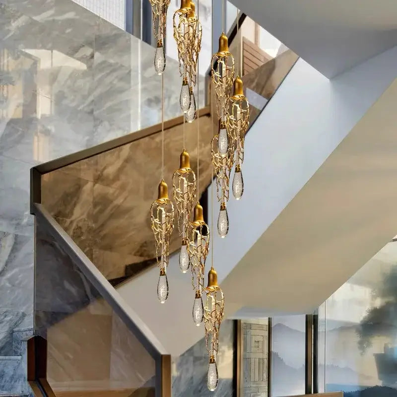 Elegant modern gold branch art cage crystal chandelier with intricate leaf metalwork and dangling teardrop crystals for dining room decorbites branch art