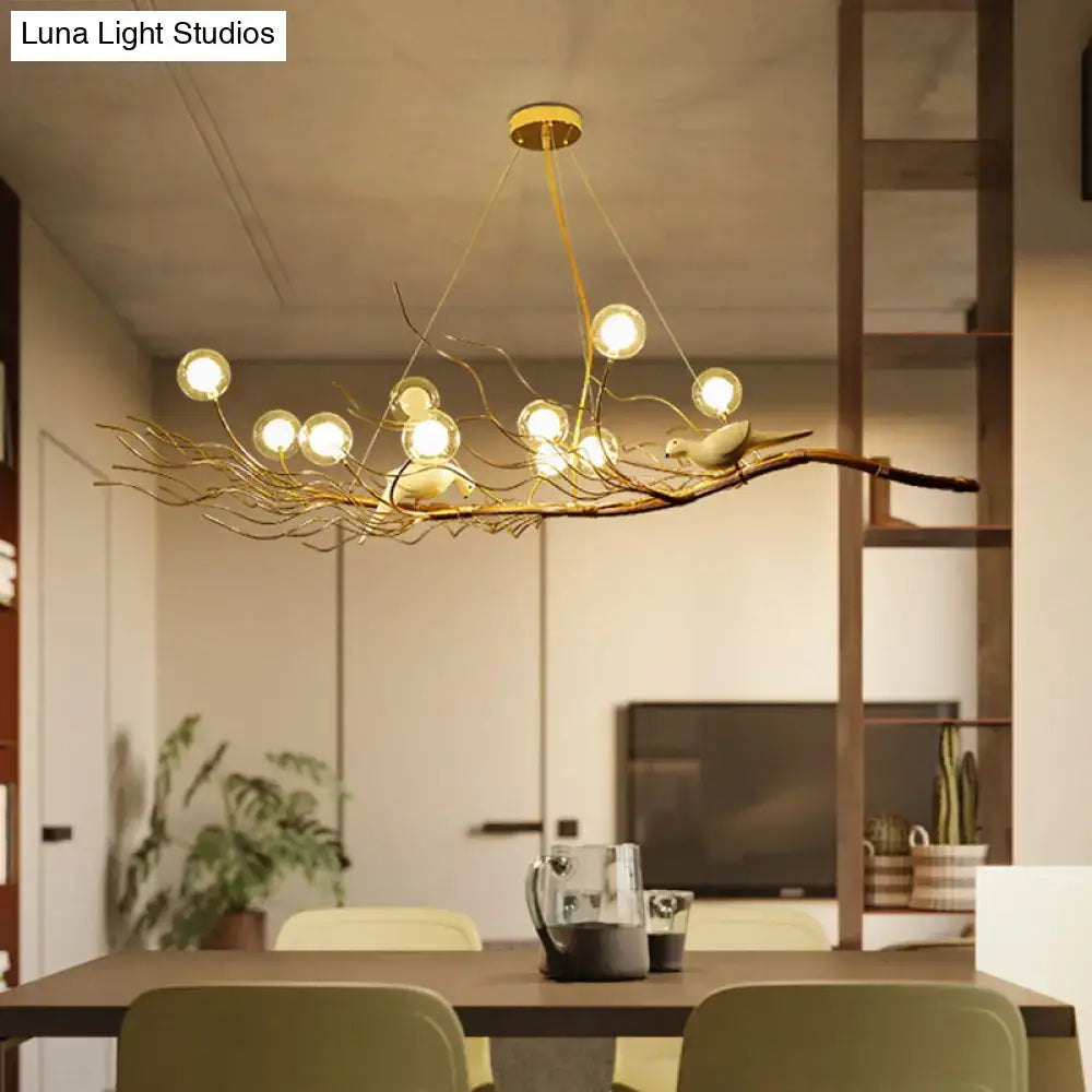 Decorbites modern gold branch pendant light with ceramic birds and spherical bulbs ideal for dining room lighting