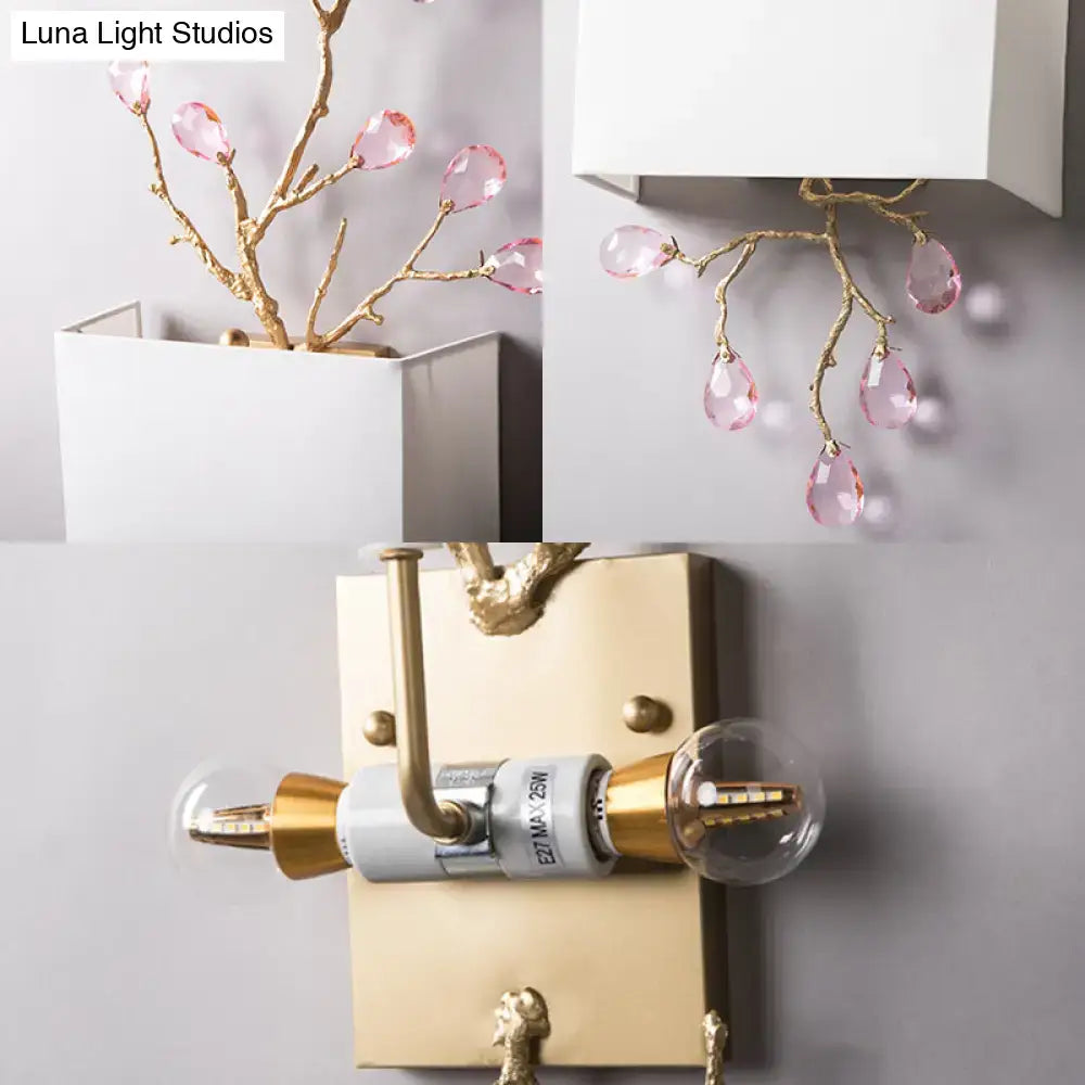 Modern gold branch wall sconce with delicate design and pink crystal accent for bedroom lighting