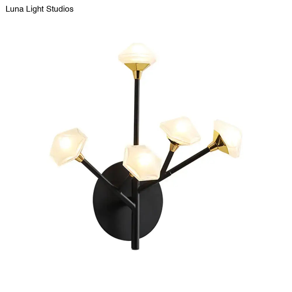 Modern gold branching wall sconce with black and gold wall light featuring five geometric acrylic shades for living room