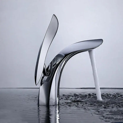 Modern gold brass basin faucet with sleek chrome finish and flowing high-heeled shoe design decorbites brass basin