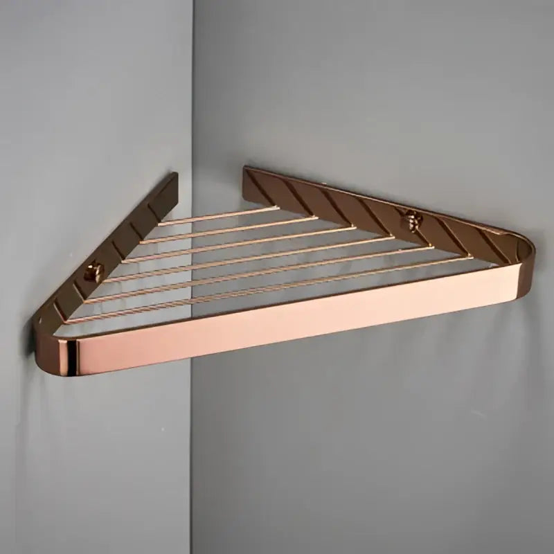 Modern gold brass bathroom shower rack with hooks featuring a rose gold triangular corner shelf and polished metal finish