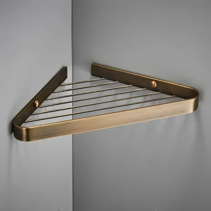 Brass bathroom shower rack with gold triangular corner shelf and wire mesh grid for modern decorbites brass bathroom use