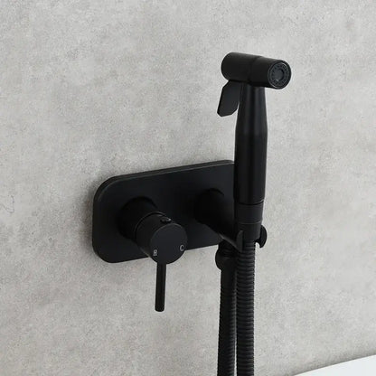 Modern gold brass bidet sprayer set with black matte wall-mounted bidet sprayer and flexible hose for bathroom use