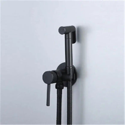 Modern gold brushed brass rose gold and black bidet sprayer set with a sleek black matte wall-mounted sprayer and flexible hose