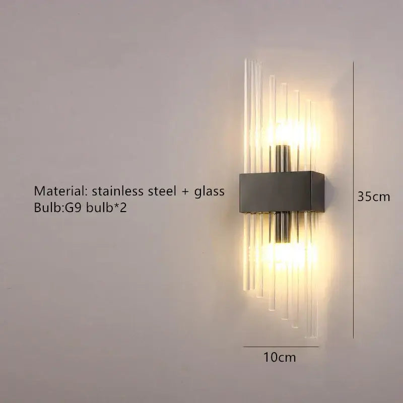 Modern gold and brushed steel wall lamp with sleek stainless steel base and vertical glass rods warm light decorbites gold led