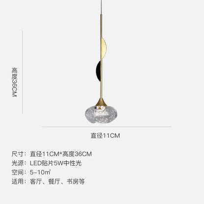 Modern gold bubble crystal pendant light with a textured clear glass shade and metal stem for dining room decorbites bubble crystal