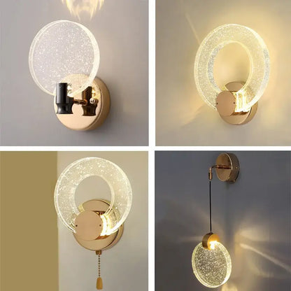 Modern gold bubble crystal pendant lights with gold-toned circular wall sconce and warm ambient light for living room