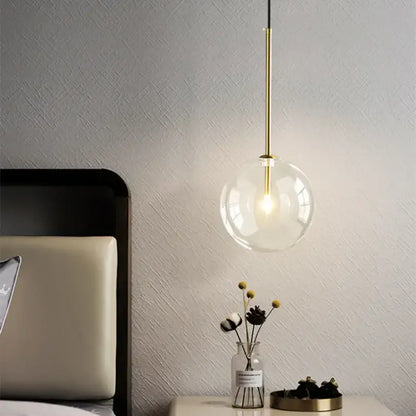 Modern gold bubble glass ball pendant light with clear glass globe and slender gold-toned rod for kitchen decorbites bubble glass