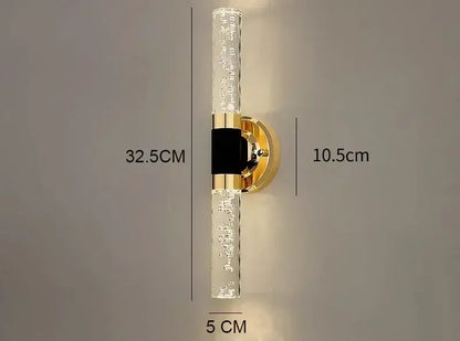 Modern gold bubble glass vanity lights feature gold vanity lights with clear textured glass tubes and a black central decorbites gold accent