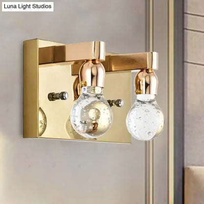 Modern gold bulb shaped crystal wall sconce with two clear bubble-filled glass globe shades for 110v-120v use