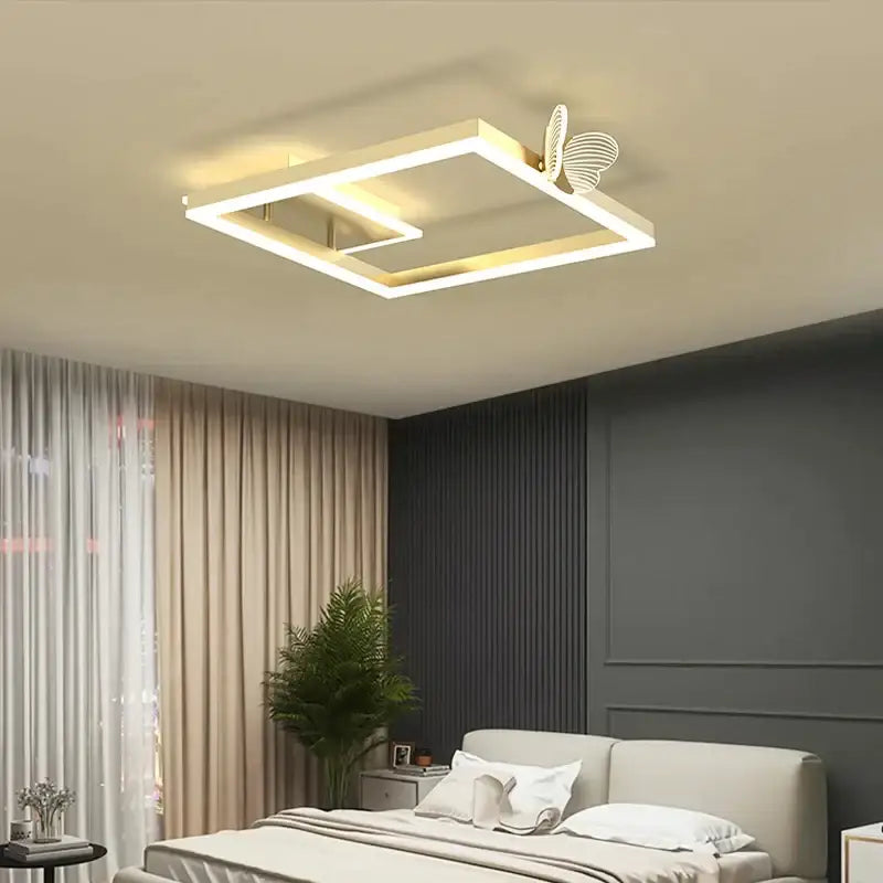 Modern gold butterfly ceiling lamp with illuminated edges and gold-toned decorbites butterfly ceiling accent for living room