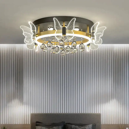 Modern gold butterfly crystal ceiling light with illuminated wings and dangling droplets for bedroom decorbites elegant ceiling lamp