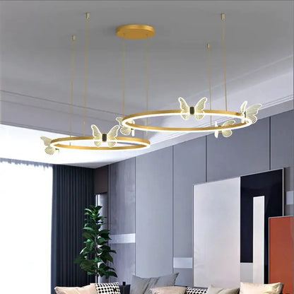 Modern gold butterfly crystal chandelier with illuminated butterfly motifs suspended by thin cords for dining room decorbites butterfly crystal lighting