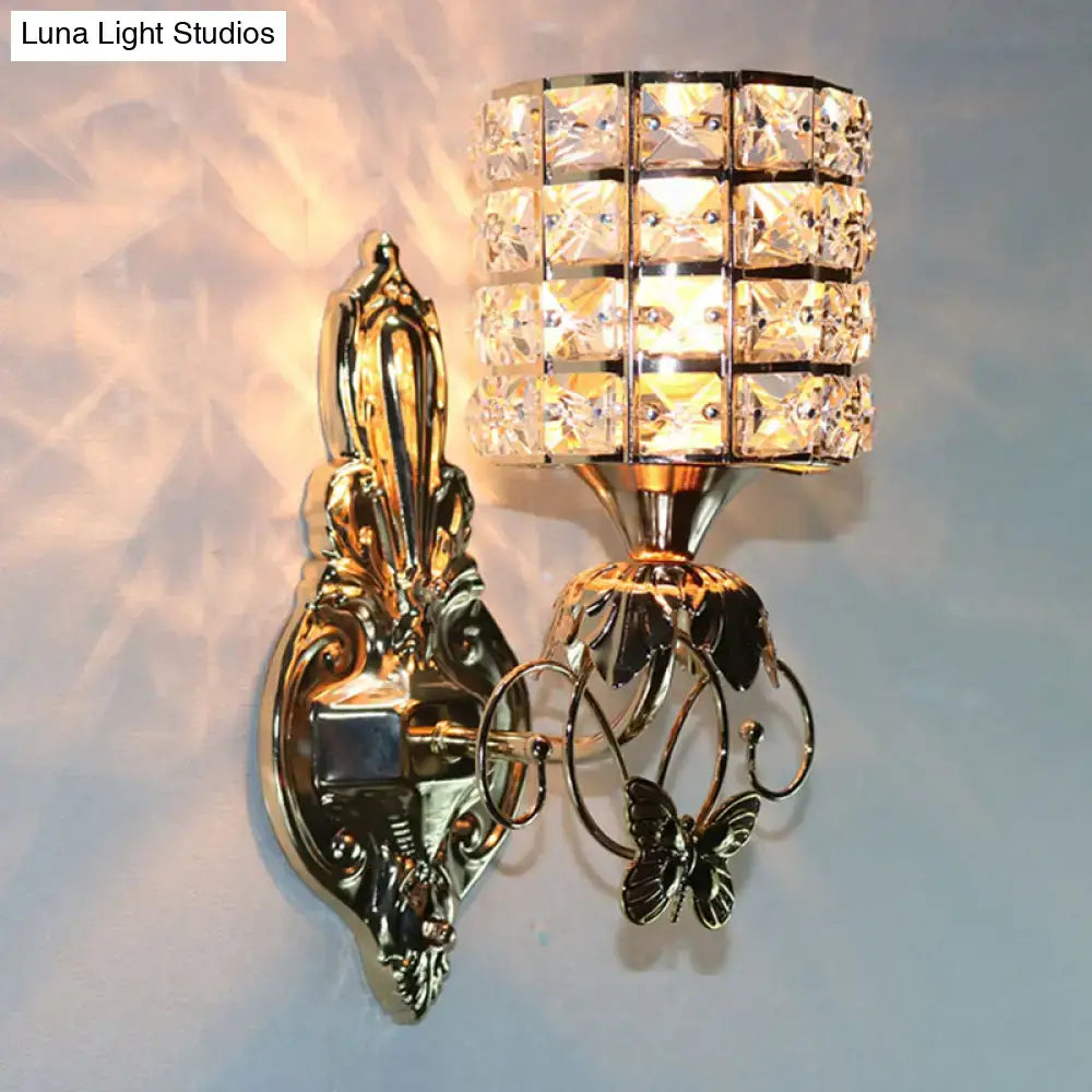 Modern gold butterfly wall light fixture with crystal shade and ornate cylindrical design for living room sconce