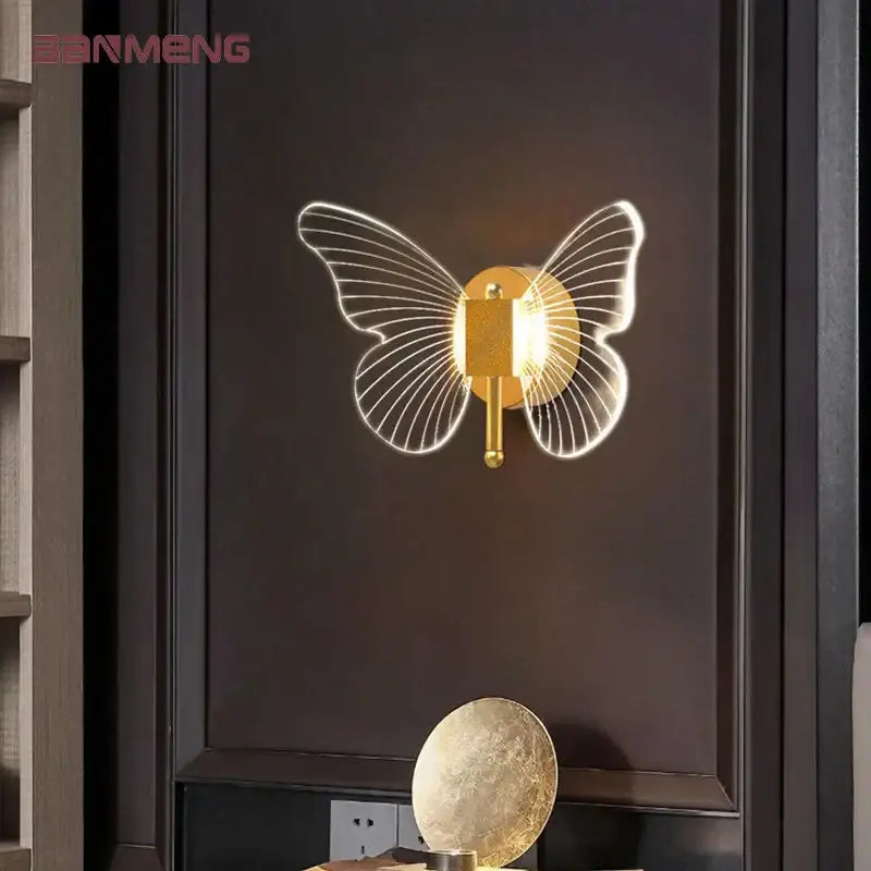 Modern gold butterfly nordic led wall lamp with illuminated translucent wing details for stylish bedroom decorbites butterfly nordic sconce