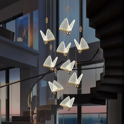 Elegant gold-toned decorbites butterfly pendant lights with lace-like glass panels and warm glow for modern bedroom decor
