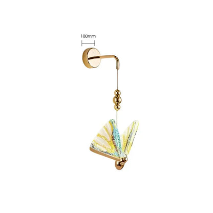 Modern gold wall lamp with a delicate iridescent butterfly pendant in pastel blue and yellow for bedroom decorbites butterfly wall