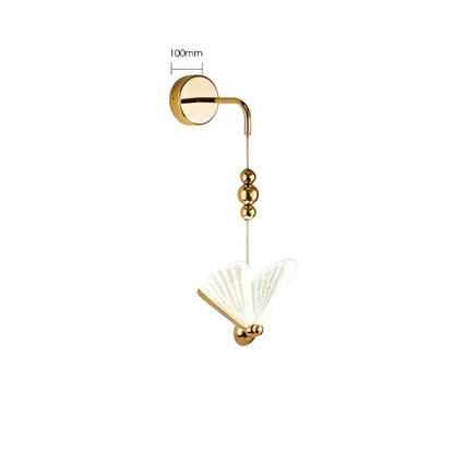Modern gold butterfly wall lamp with sleek curved arm and decorative beads for bedroom lace decor by decorbites wall lamp