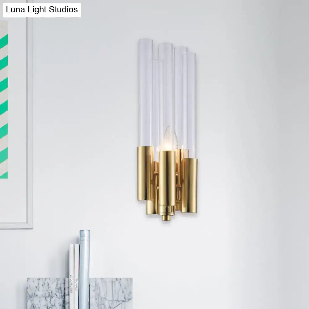Modern gold candelabra sconce with five clear acrylic flute crystal shade tubes on polished gold metal base for bedroom light