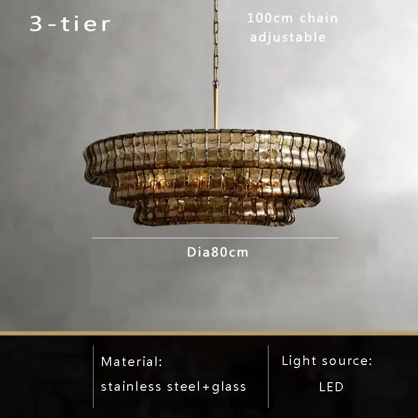 Modern gold cascading crystal pendant lights featuring a three-tiered brown glass pendant with stainless steel frame and adjustable chain