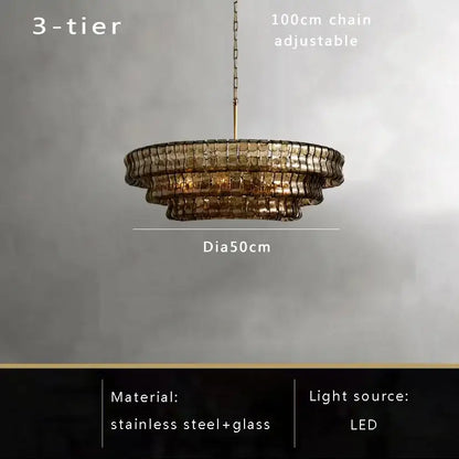 Modern gold cascading crystal pendant lights featuring a three-tiered brown glass pendant with stainless steel frame