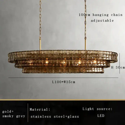 Modern gold cascading crystal pendant lights with smoky grey brown glass pendant and stainless steel tiered design