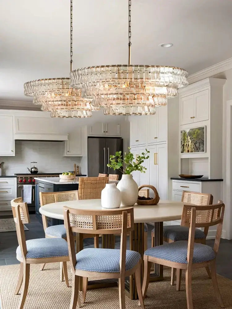 Modern gold cascading crystal pendant lights with brass finish and clear glass prisms for elegant dining room decorbites brown glass
