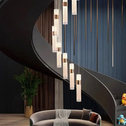 Modern gold cascading pendant light with clear glass cylinders and adjustable height for dining room use