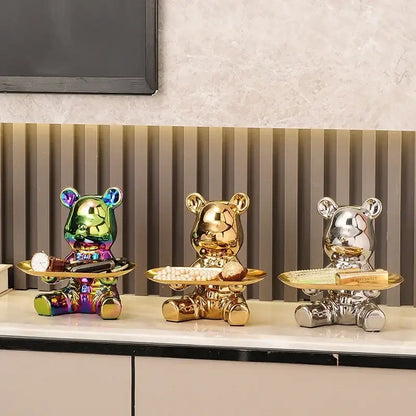 Three glossy gold ceramic electroplating bear figurines each holding a tray with decorative items for living room decor