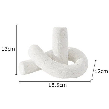 Modern gold decorbites ceramic knot sculpture featuring white speckled abstract interlocking cylindrical forms for decor