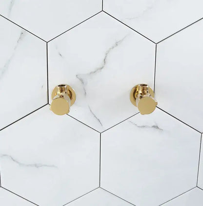 Modern gold and chrome brass triangle valve bathroom water control with gold finished brass triangle handles on white marble tiles