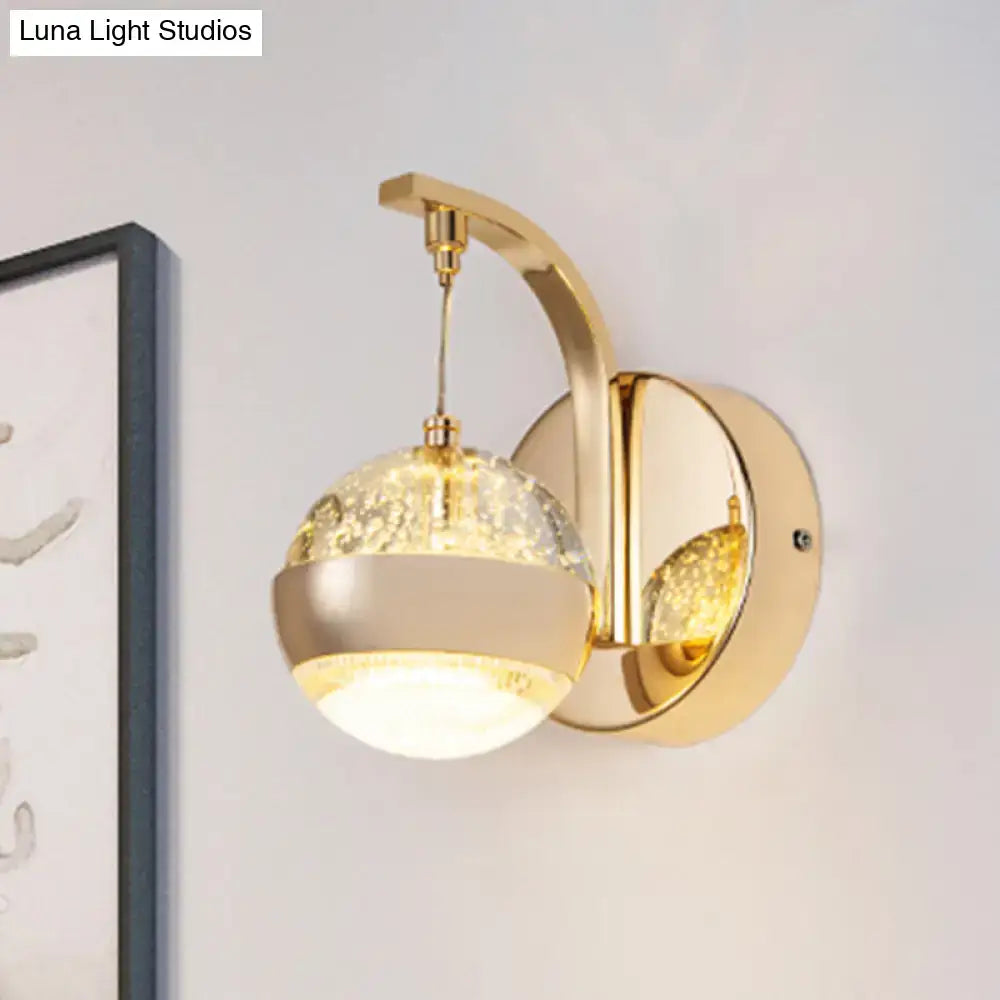 Modern gold chrome wall light with spherical crystal ball glass globe and internal led lighting for bedroom use