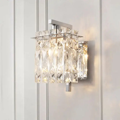 Modern gold and chrome wall light with clear crystal prisms featuring e12 e14 fixture width for living room use