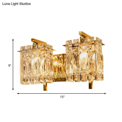Gold-toned wall light fixture with asymmetrical crystal glass elements compatible with e12 e14 bulb base