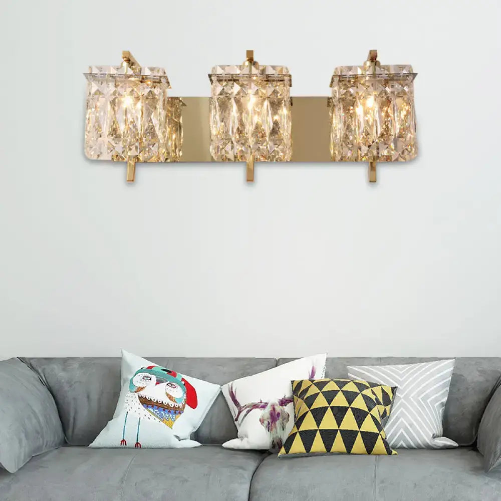 Modern gold and chrome wall light fixture with three crystal encased e12 e14 bulbs and elegant fixture width design