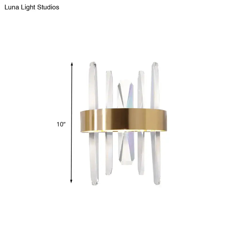 Modern gold wall sconce with clear crystal bar rods and sleek circular base for bedroom lighting