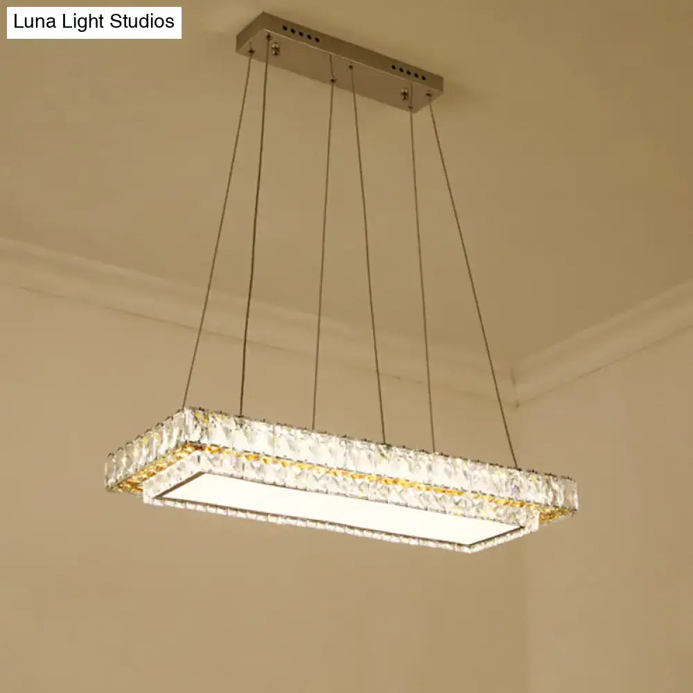 DecorBites modern LED suspension light featuring clear crystal blocks and a sleek metallic frame for dining rooms