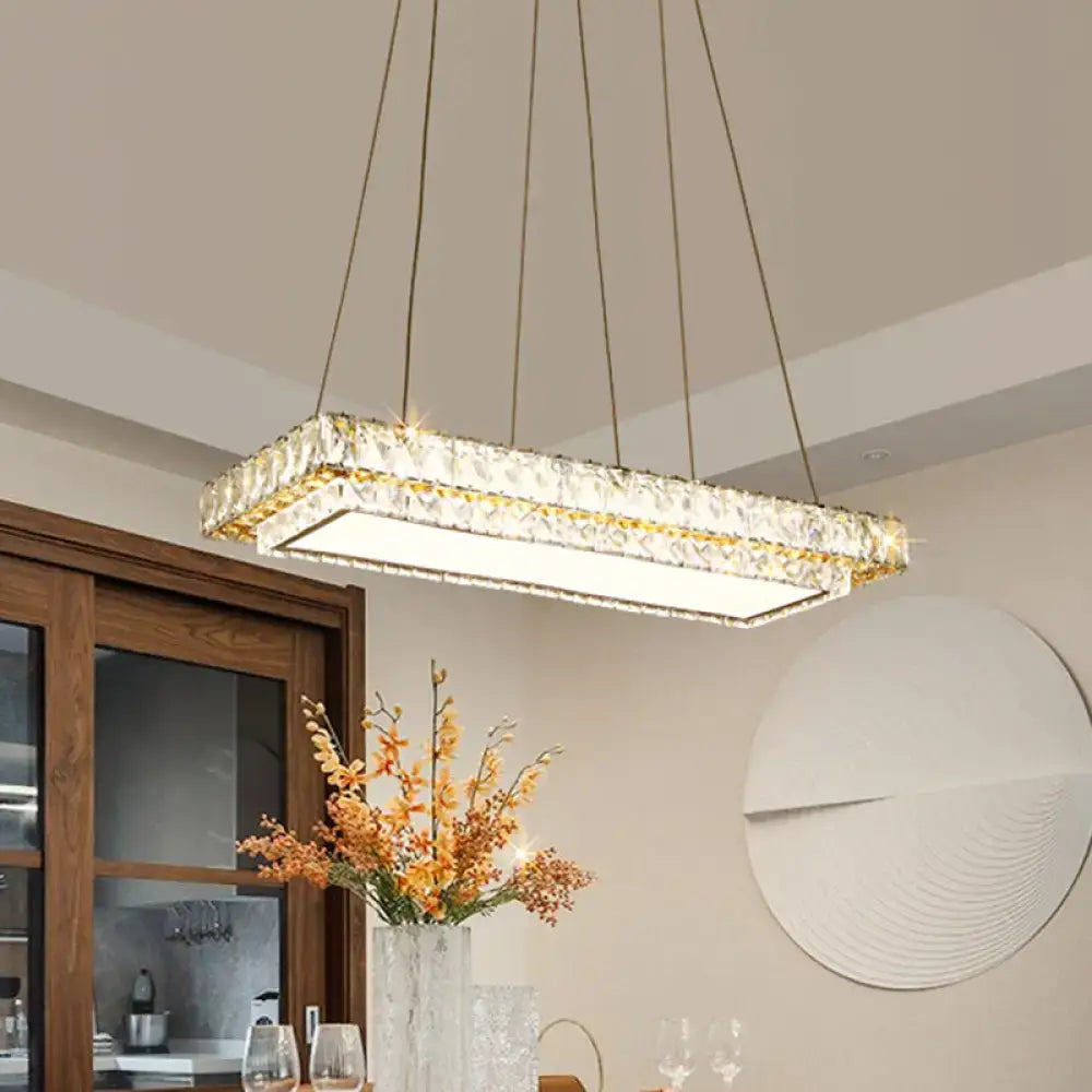 Rectangular crystal chandelier with clear crystal blocks and gold-toned accents for dining room and kitchen island