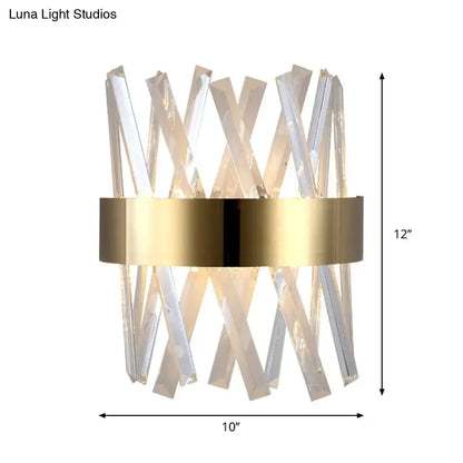 Modern gold clear crystal sconce with a metallic band and fixture height of 12in for bedroom wall lighting