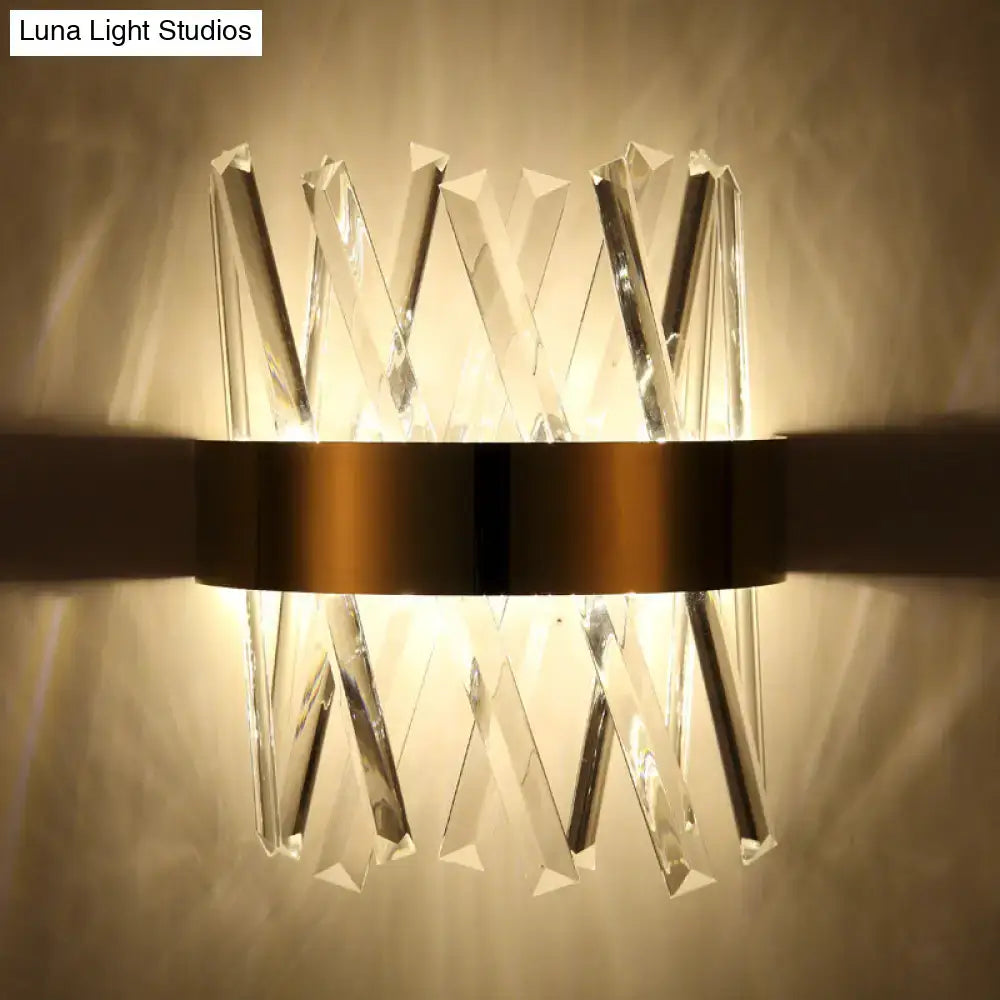 Modern gold clear crystal wall sconce with faceted prisms in x-shaped pattern and fixture height 12in for bedroom use