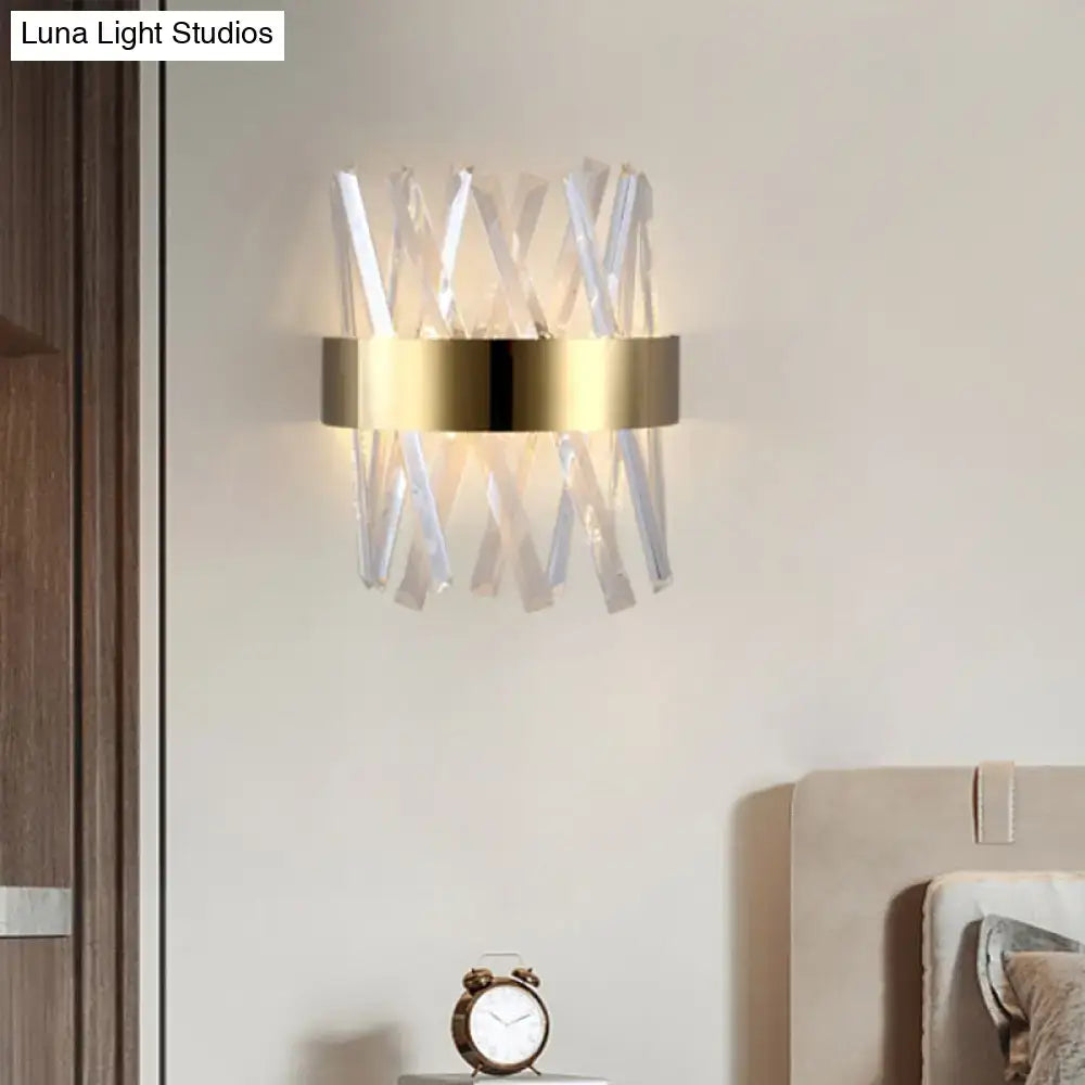 Modern gold wall sconce with clear crystal rods in x-pattern and sleek metallic ring fixture height 12in